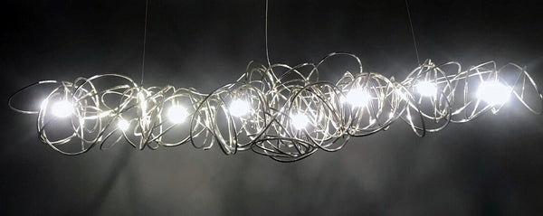 Lights of Scandinavia - Ball of Yarn - Breathtaking art deco lighting. Bent aluminum framework in 4 color variants, equipped with multiple E17 light sources. This chandelier will make the most of your living room area, add style to a conference room or act as the perfect icebreaker for the reception. Each Ball of Yarn is handmade so allow for slight differences between the photos and your finished product.