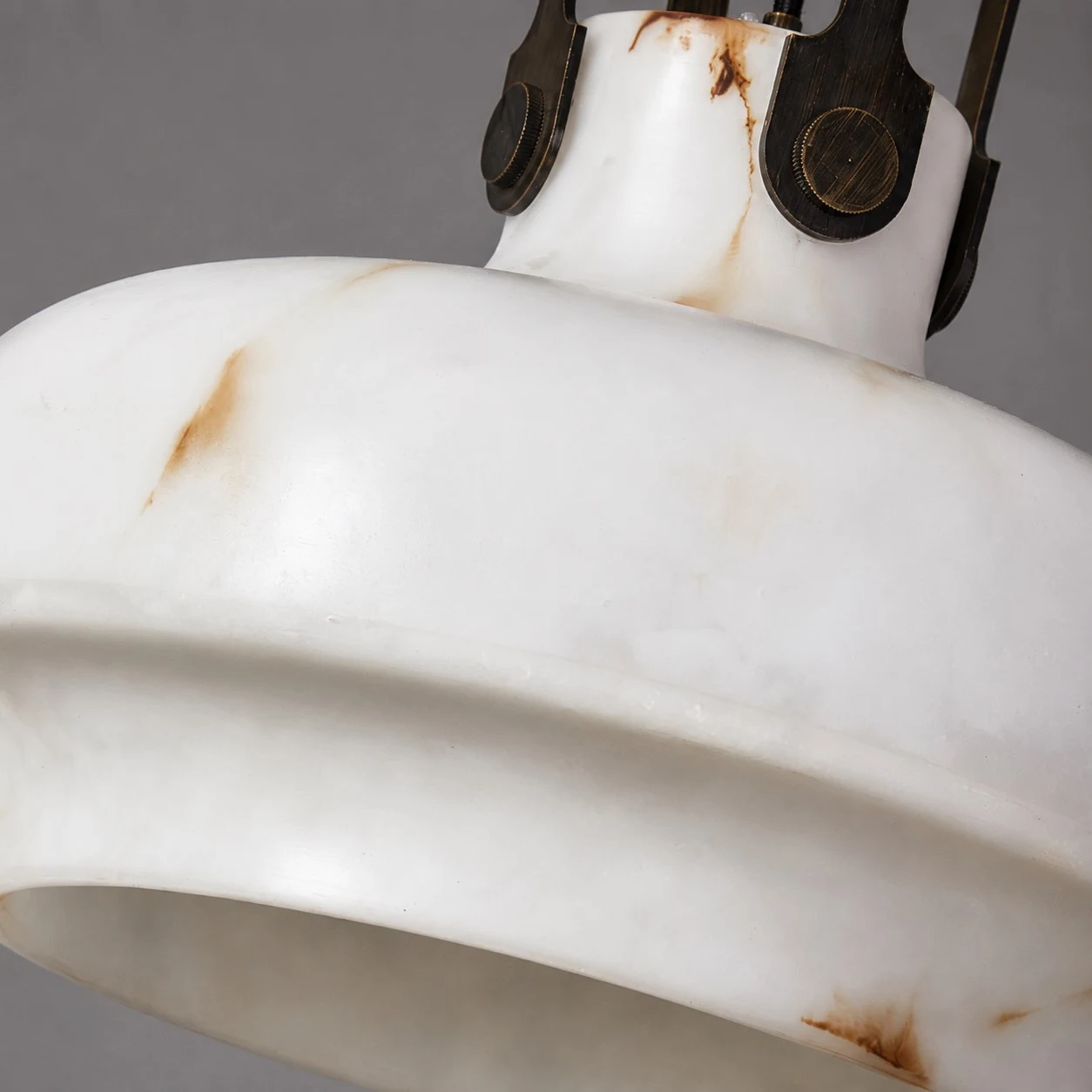 Close view of the softly lit faux alabaster shade