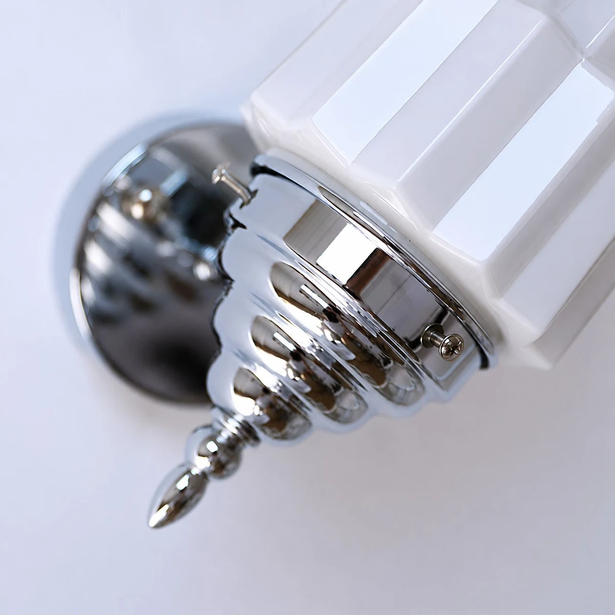 Chrome shade holder and wall arm detail