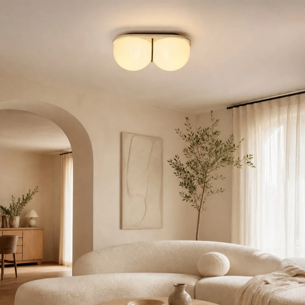 Cream travertine ceiling lamp above a sofa