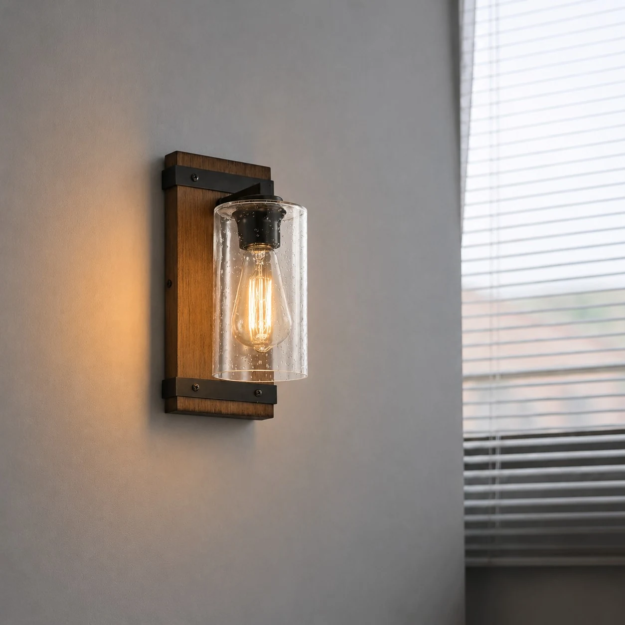 Wall lamp installed beside a bright window