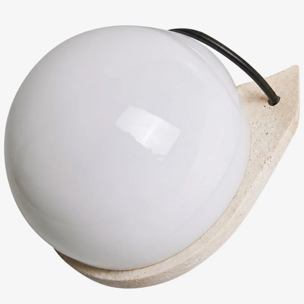 Travertine stone and white glass globe close detail