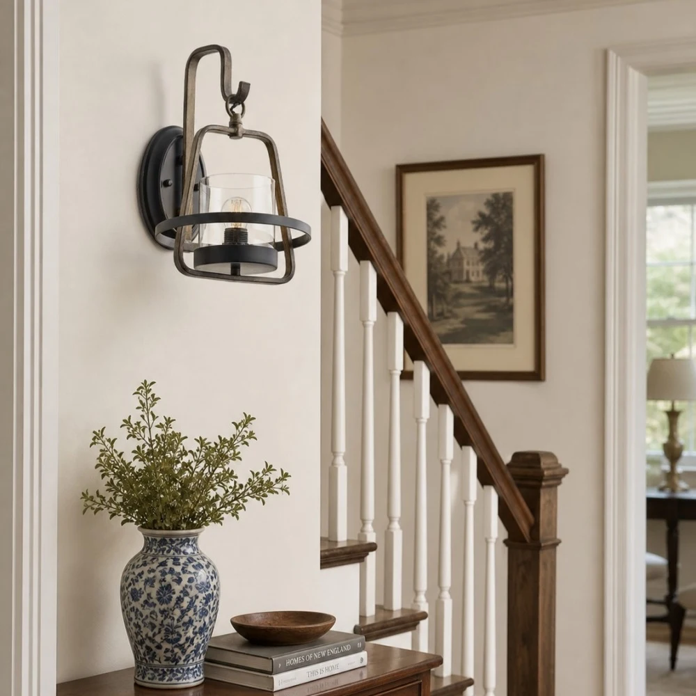 Rust metal wall sconce styled near entry table