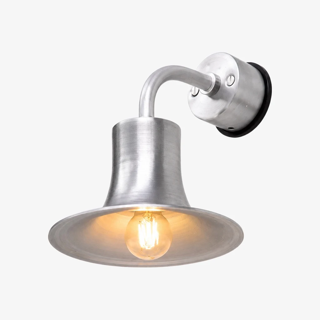 Silver aluminum wall sconce with warm bulb glow