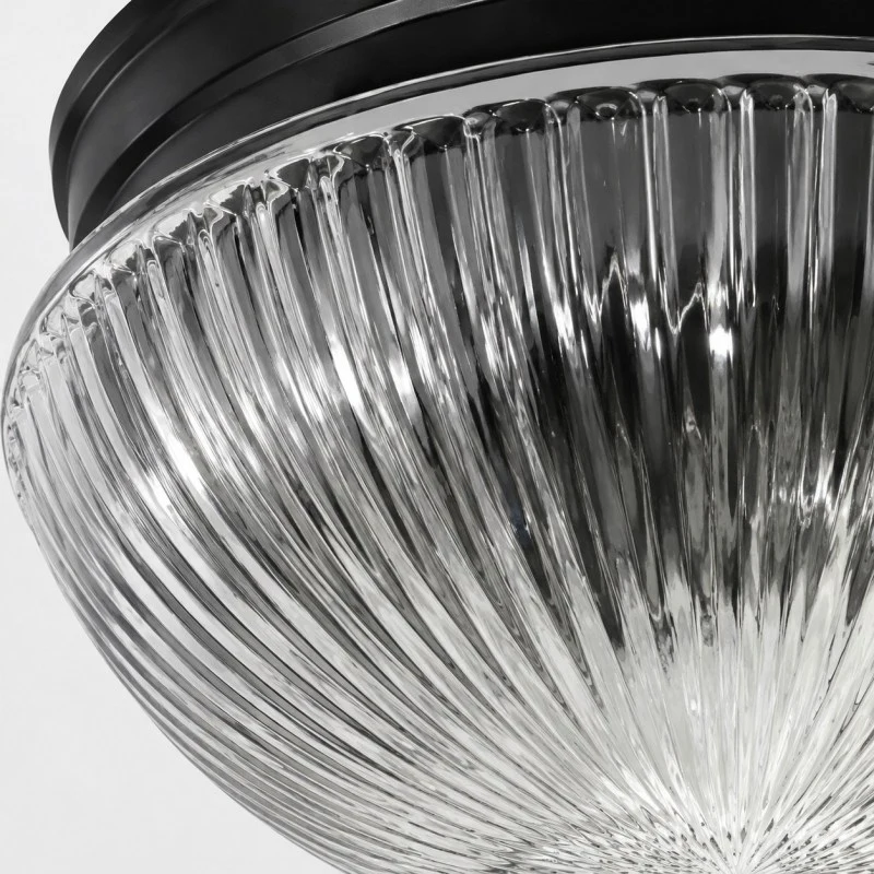 Close detail of ribbed clear glass texture and black canopy