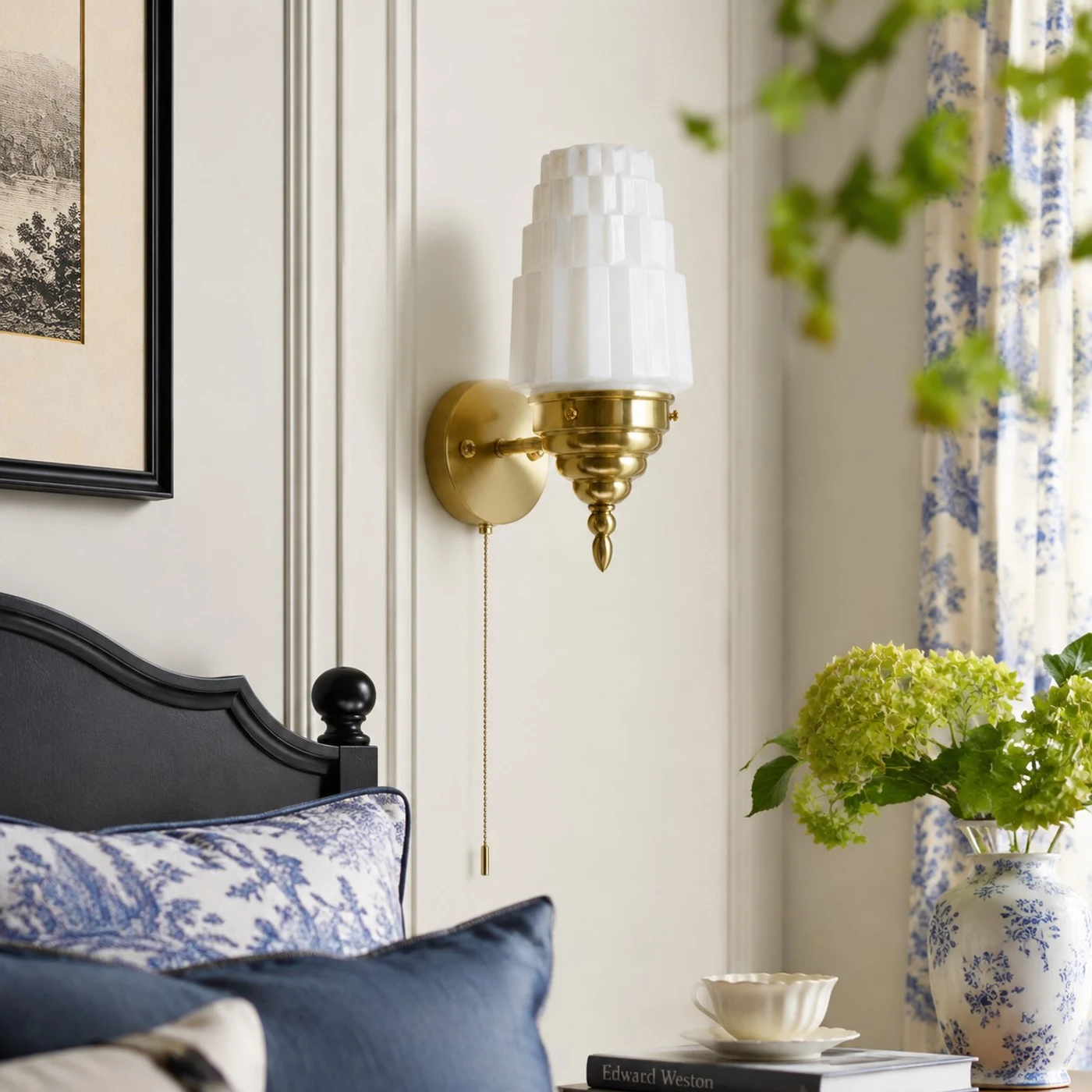 Antique brass white glass wall light in a bedroom scene