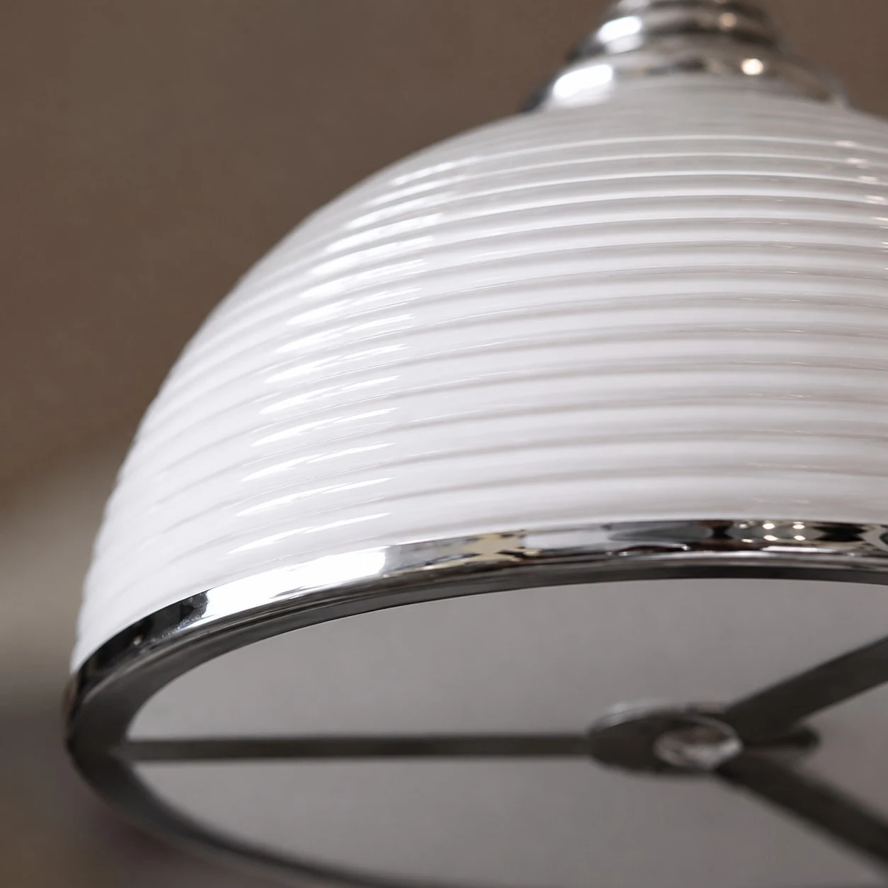 Close detail of the white ribbed shade and lower rim