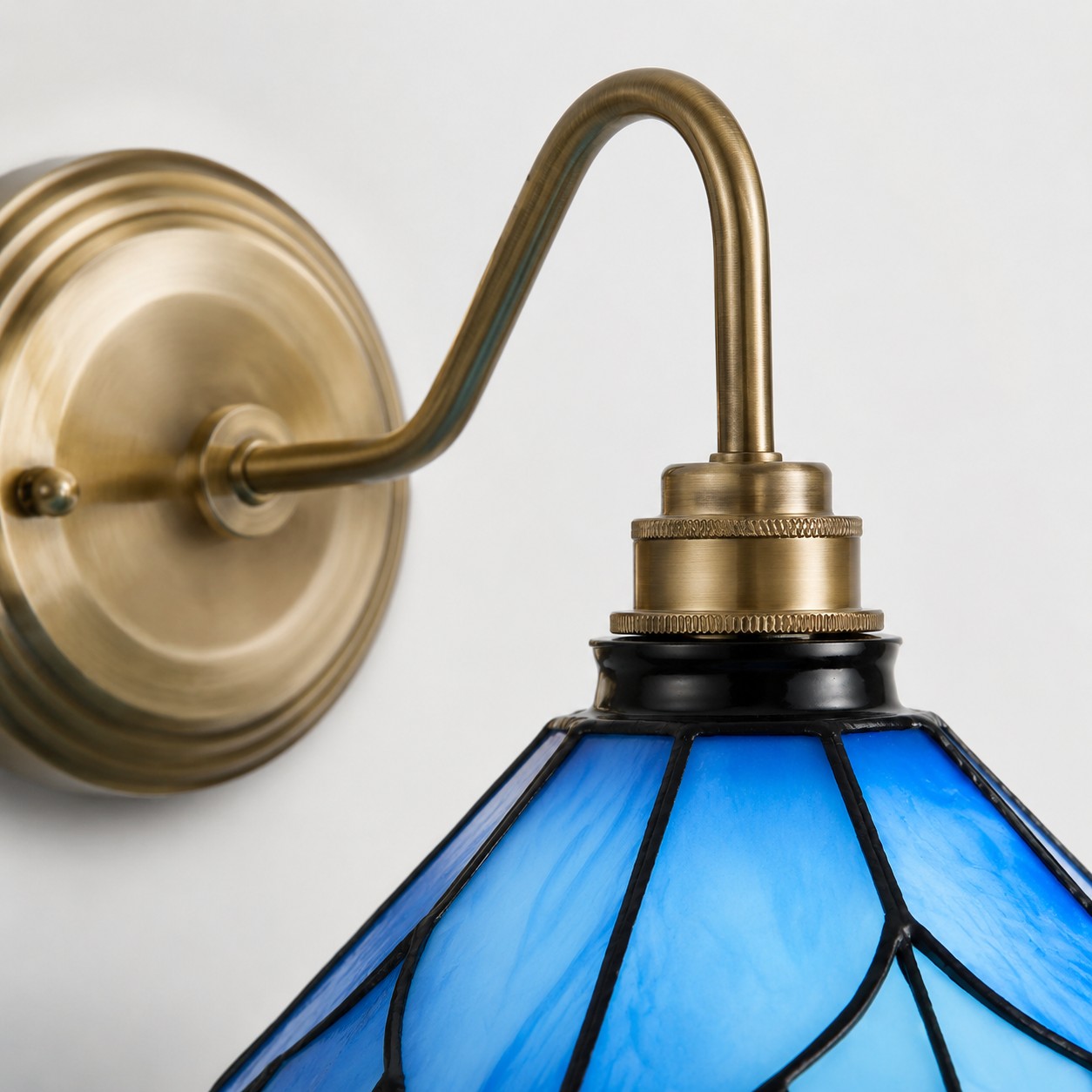 Blue Stained Glass Wall Sconce With Curved Arm