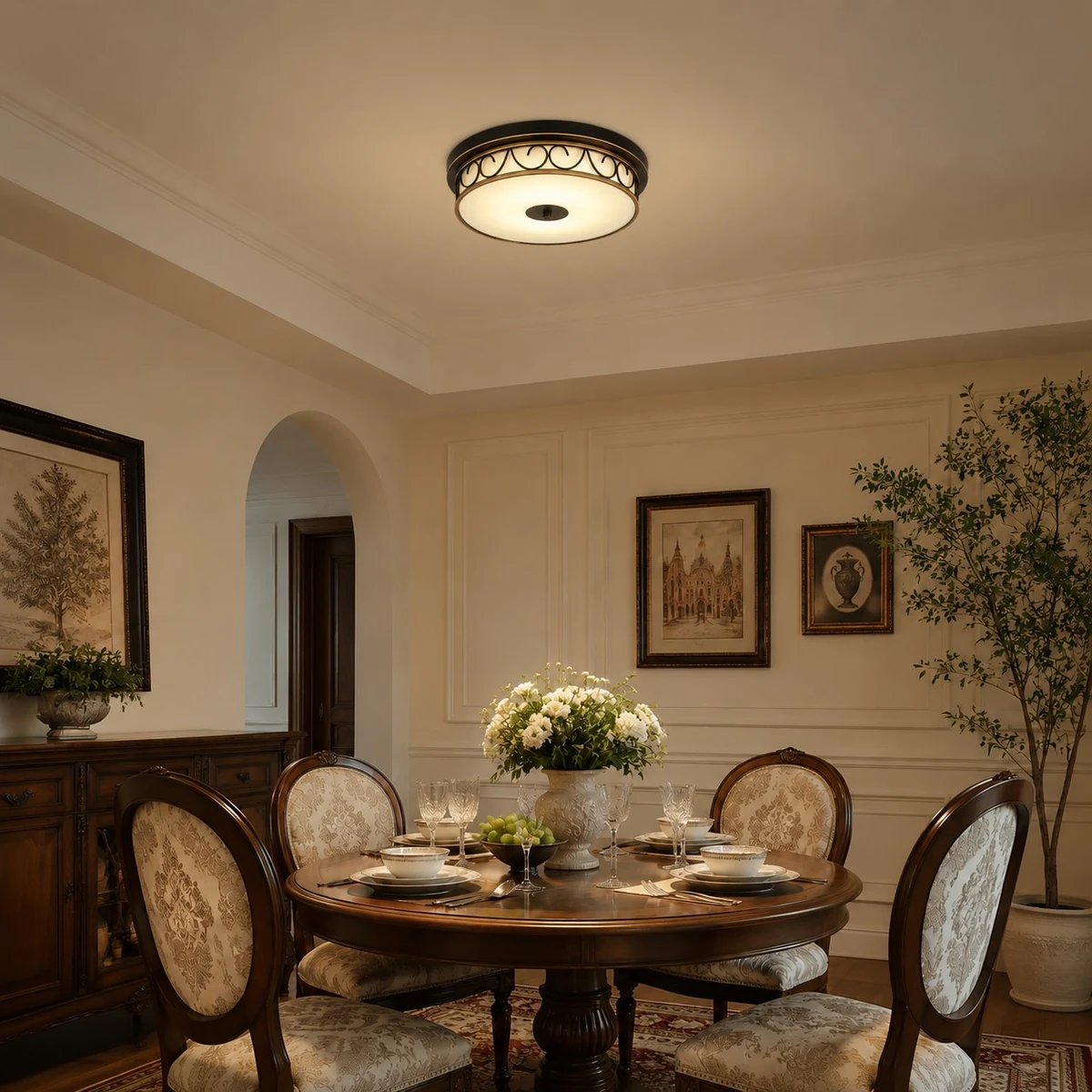 Warm flush mount ceiling light above a dining setting