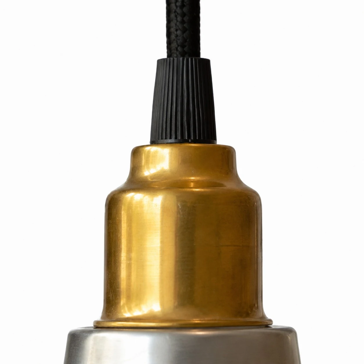 Brass-tone socket and black cord detail