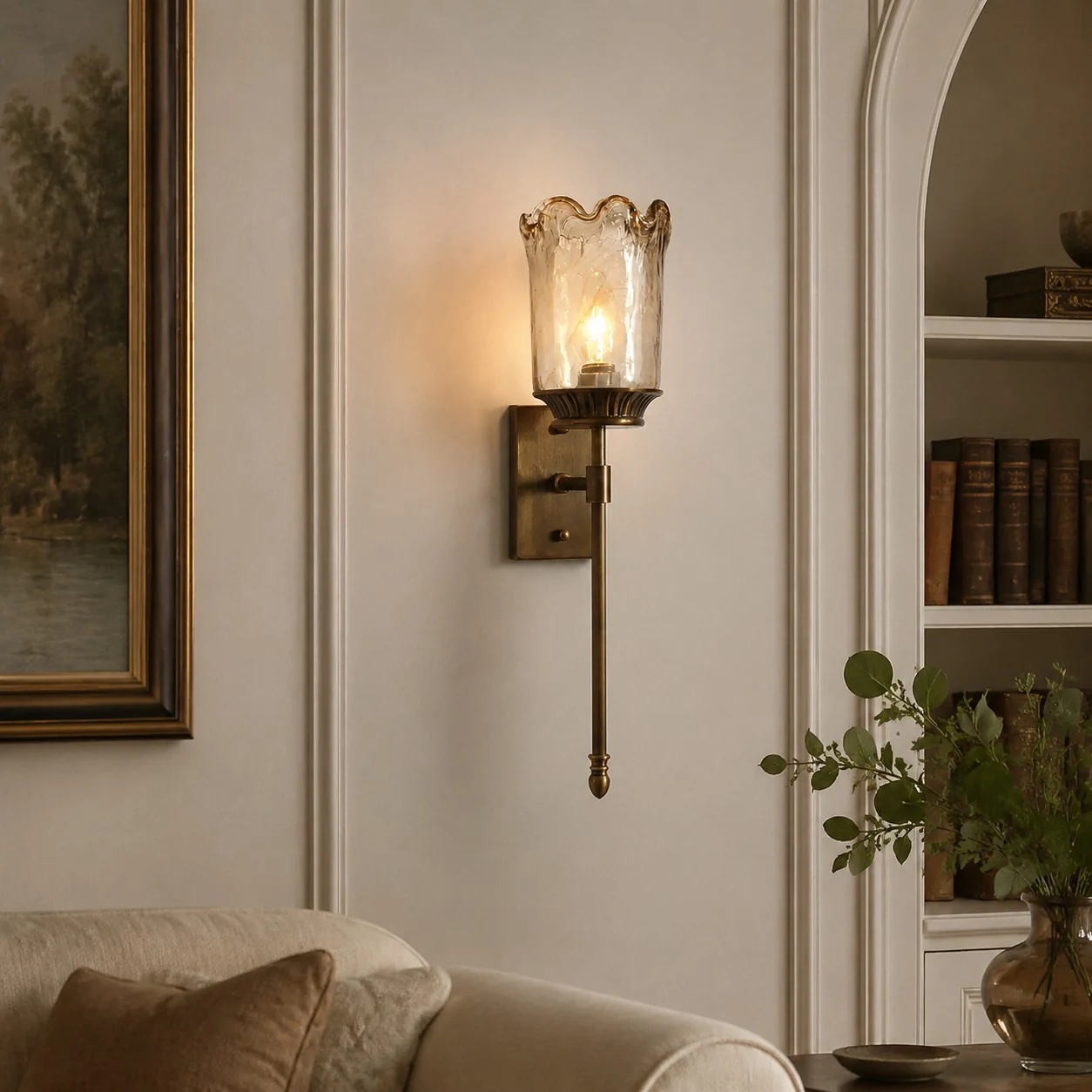 Brass amber glass wall sconce in a living room corner