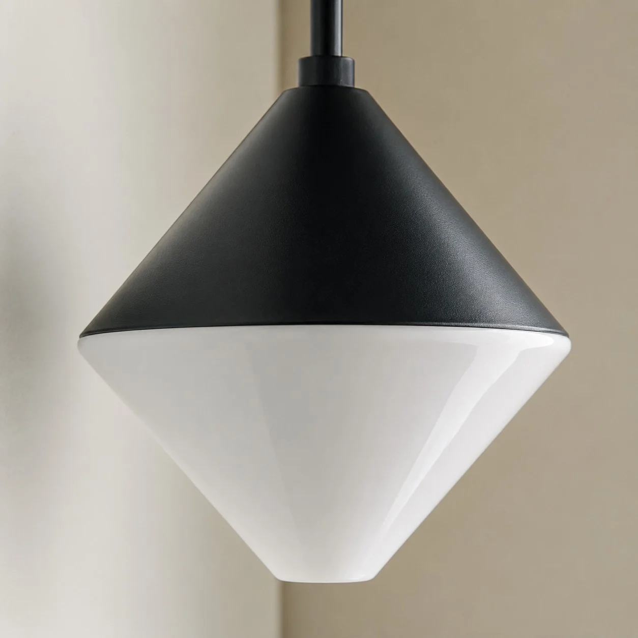 close detail of black cone shade and white diffuser
