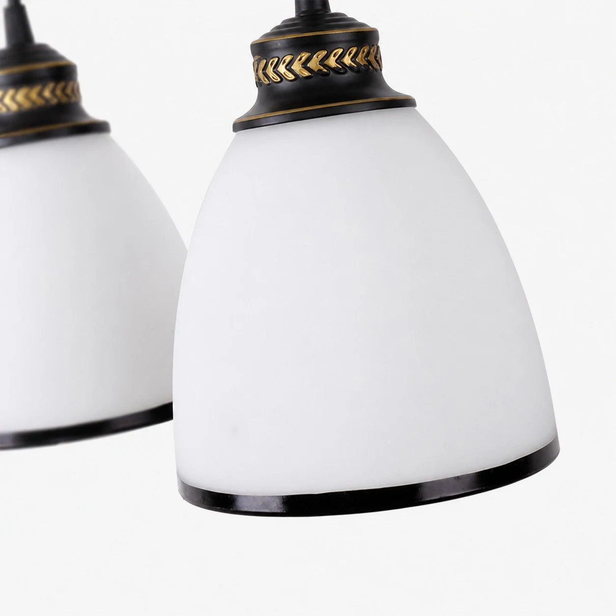 Milky glass shade, black trim, and gold accent detail