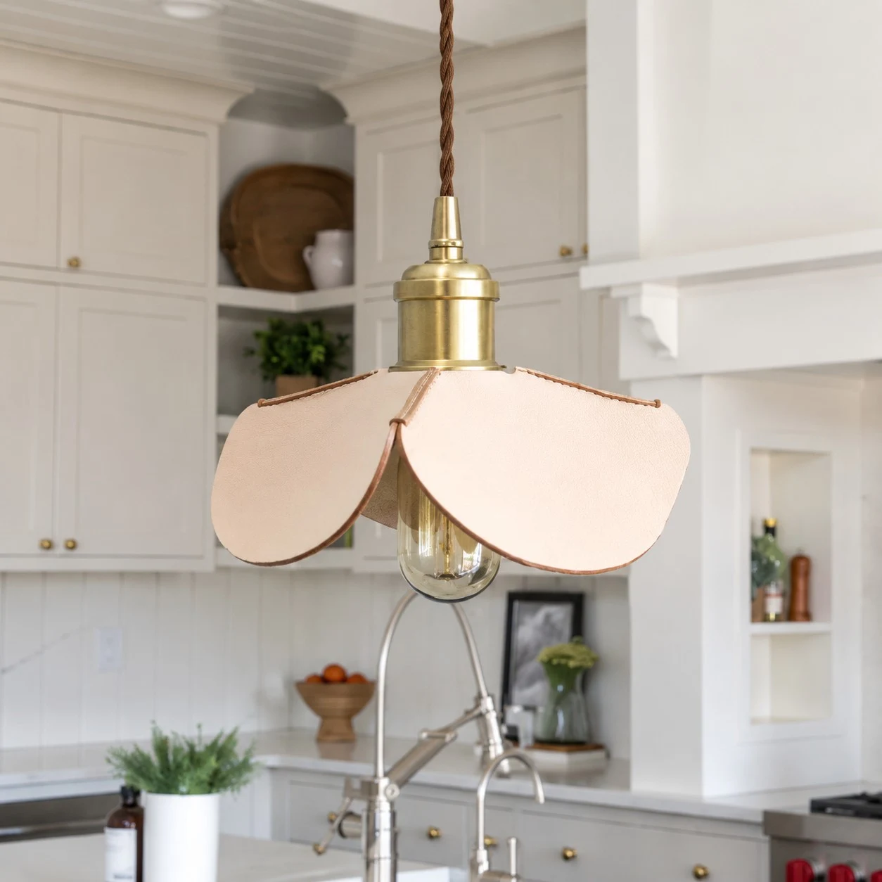 Close kitchen view of a leather petal pendant light