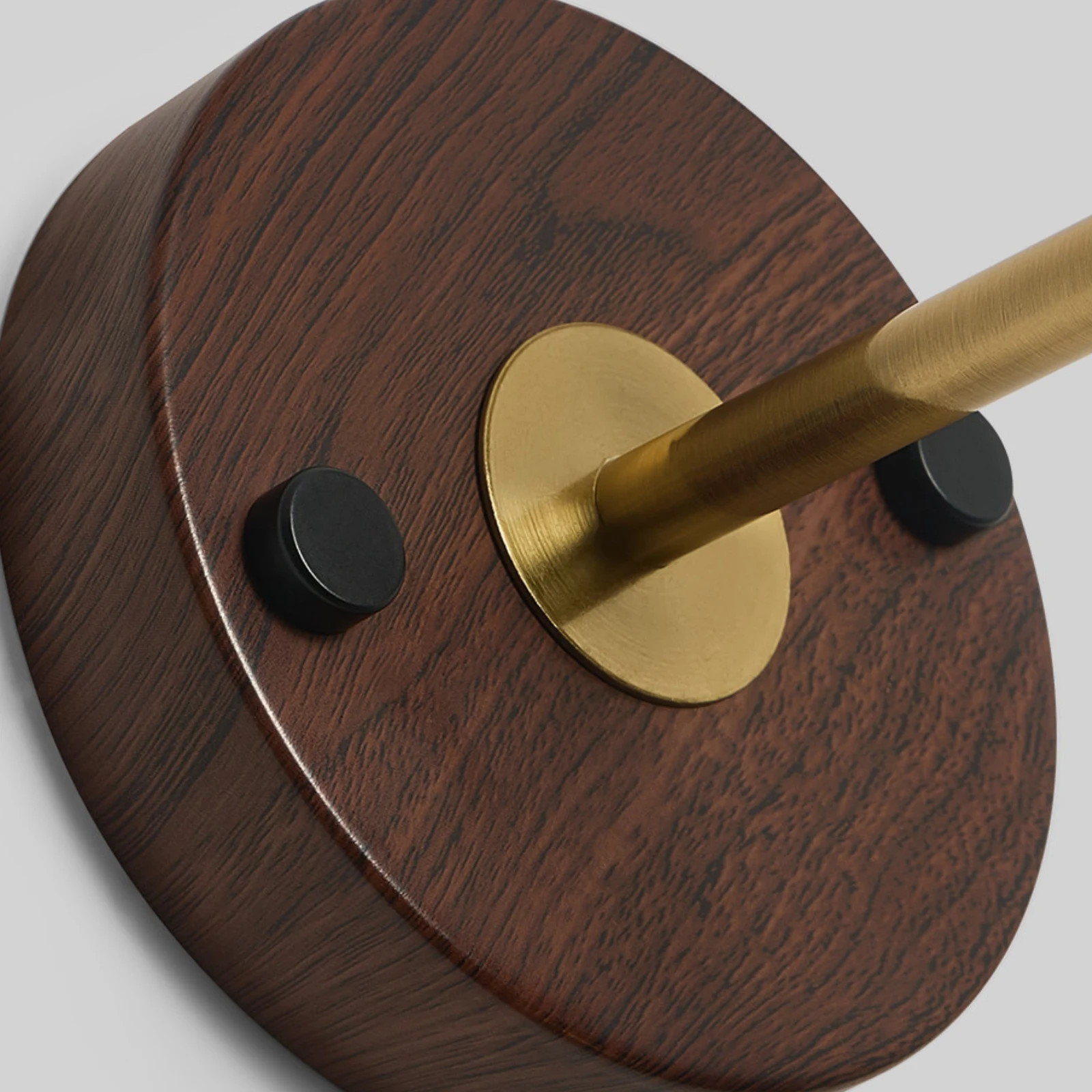 Wood round base and brass-tone arm detail