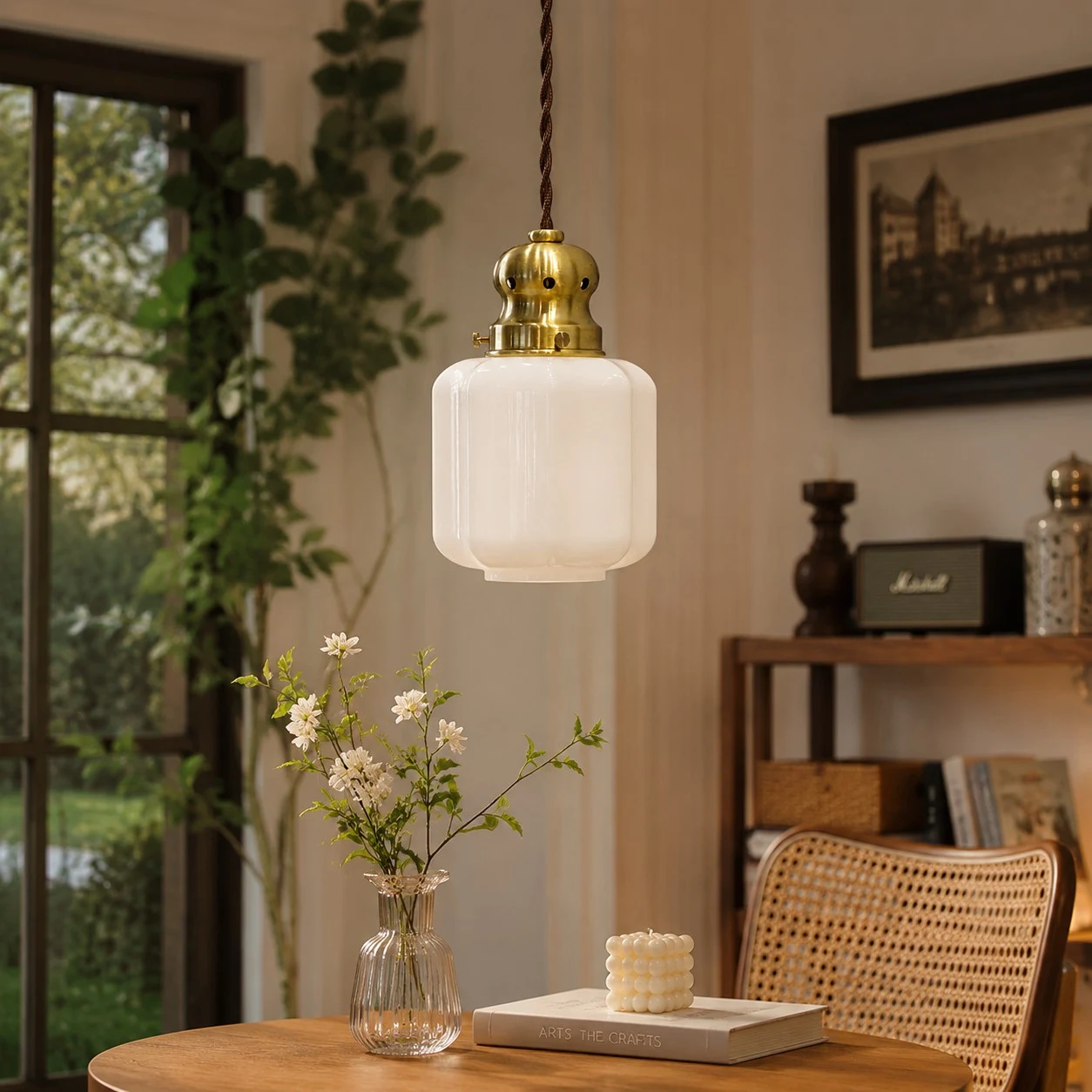 White glass pendant lamp in a cozy window corner