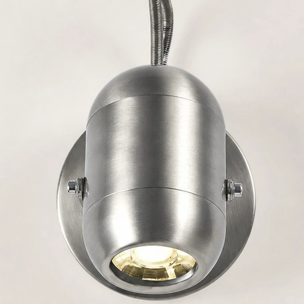 Close view of the sand nickel lamp body and side screws