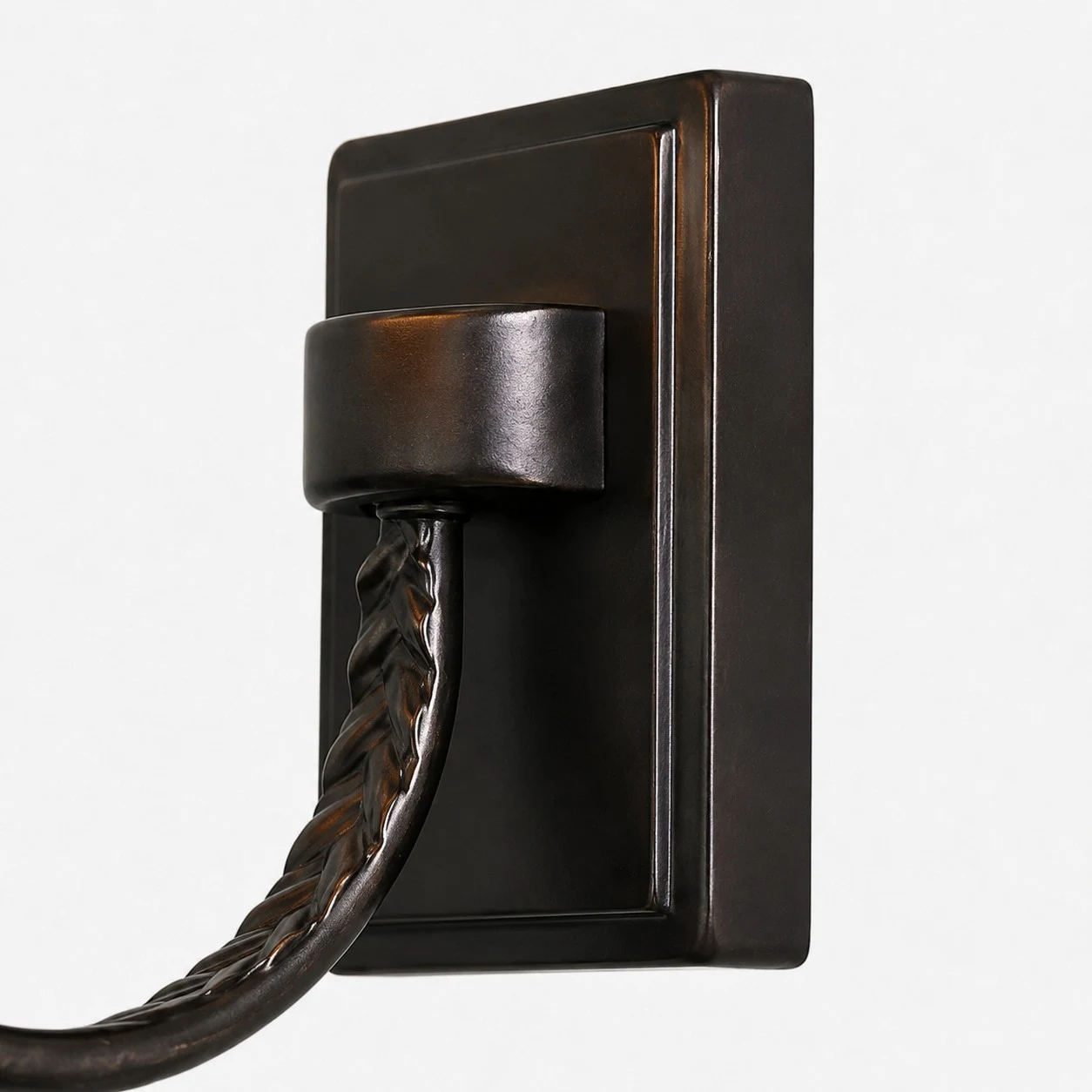 Close-up of backplate and curved metal arm