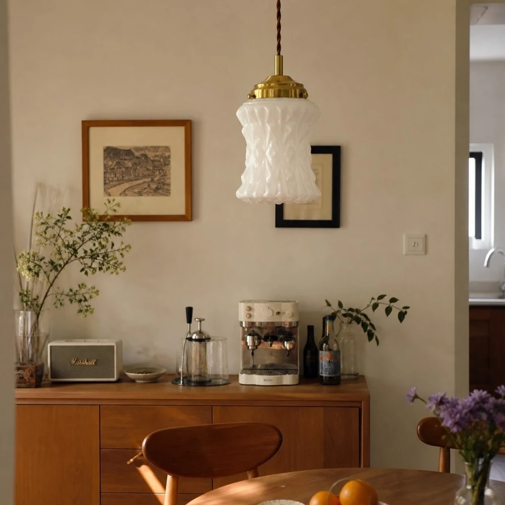 Milk glass pendant in warm kitchen corner