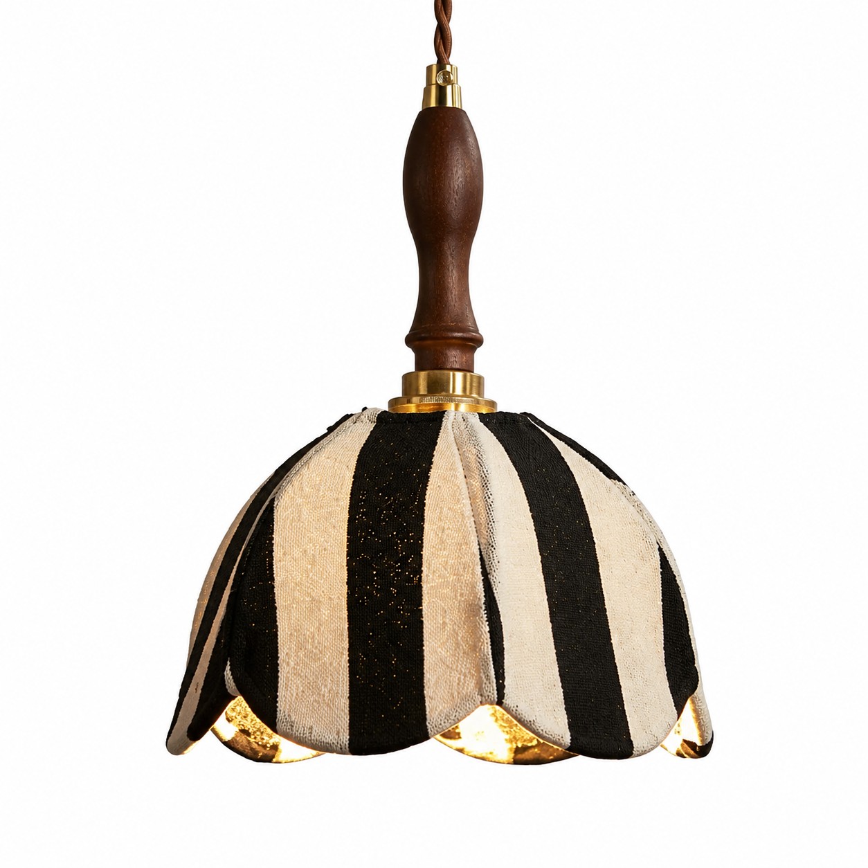 Black and ivory striped fabric pendant lamp with warm light on