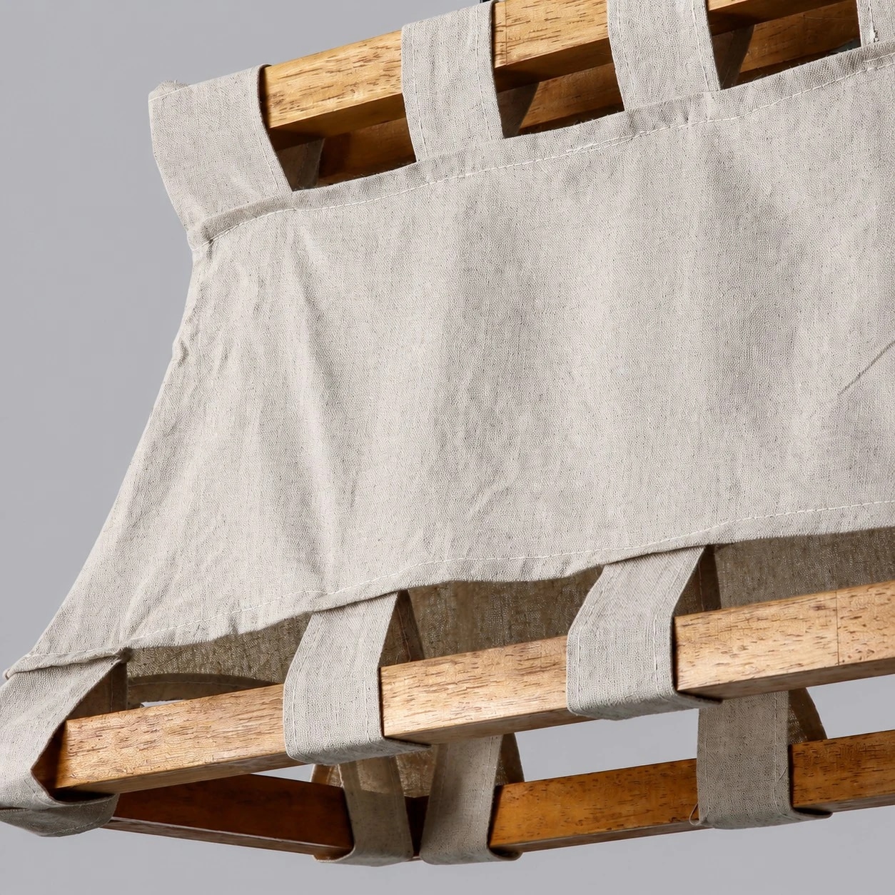 Hand woven fabric shade and wood frame detail