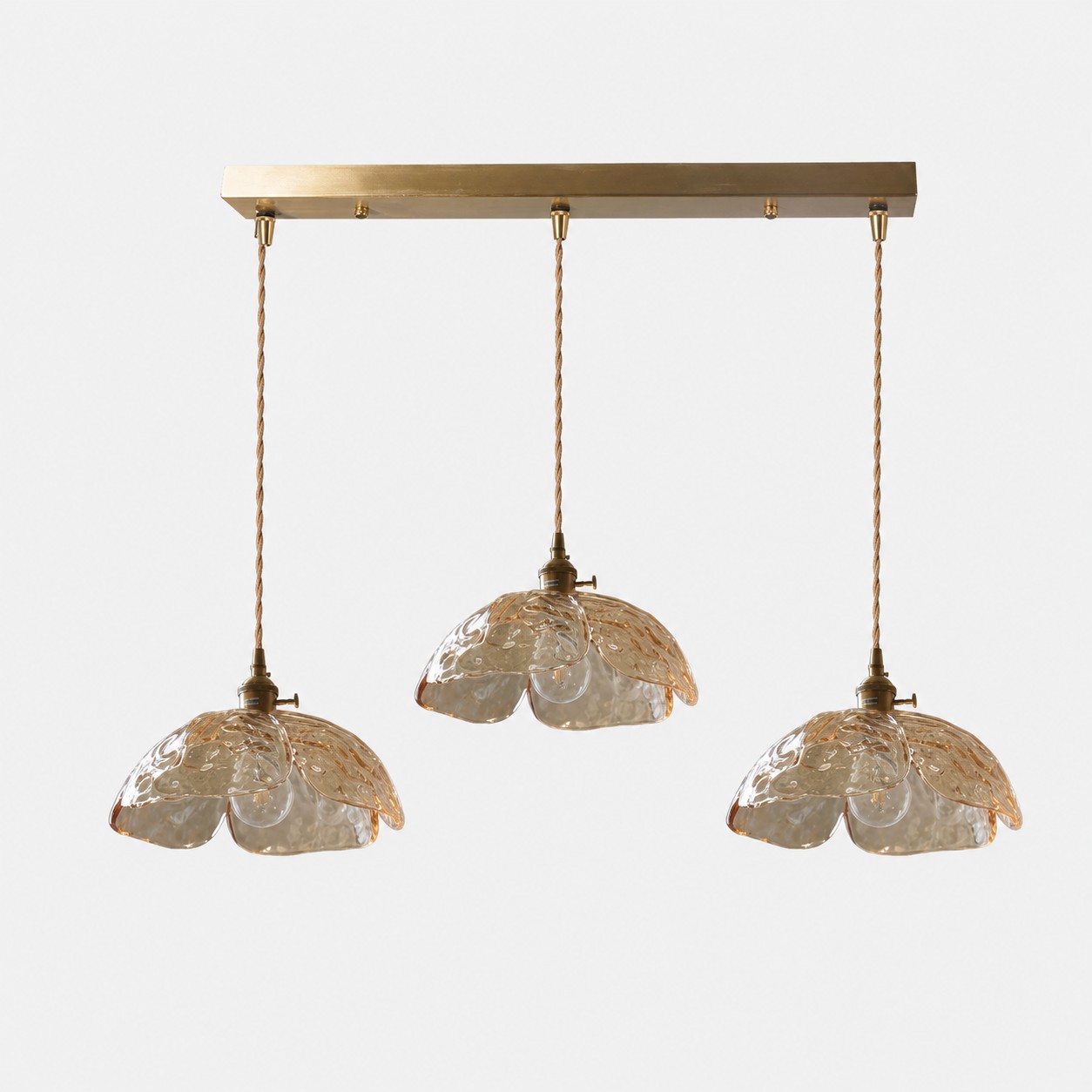 Three-light amber flower pendant with brass sockets